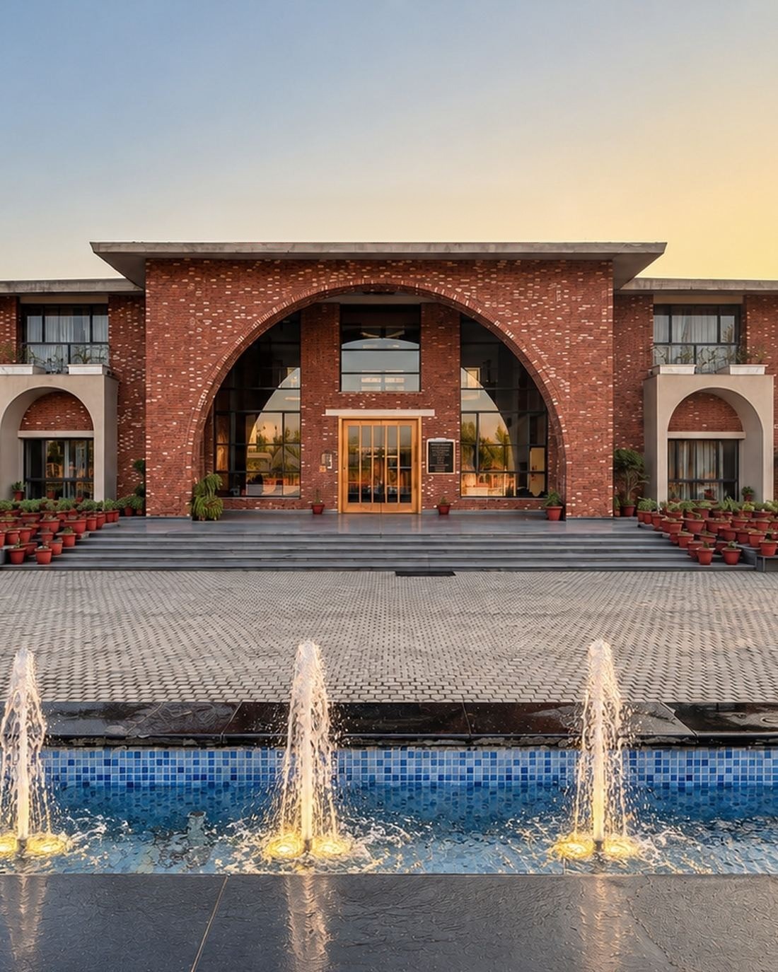 GD Goenka Public School, Dehradun - brick arch entrance at dusk